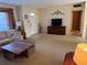 Bright living room with large front window, comfortable seating, and stylish decor at 11470 88Th Ter, Seminole, FL 33772