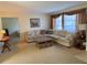 Cozy living room featuring neutral tones, plush seating, and a comfortable atmosphere at 11470 88Th Ter, Seminole, FL 33772
