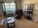 Comfortable living room featuring sofa, arm chair, and neutral carpet at 11470 88Th Ter, Seminole, FL 33772