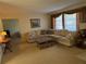 Cozy living room featuring neutral tones, plush seating, and a comfortable atmosphere at 11470 88Th Ter, Seminole, FL 33772