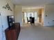 Bright living room with beige carpet and furniture with view of dining room and kitchen at 11470 88Th Ter, Seminole, FL 33772