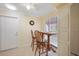 Inviting breakfast nook with bar-height table and natural light at 1157 Woodleaf Ct, Palm Harbor, FL 34684