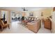 Comfortable living room with neutral tones and a view of the Florida room, offering a bright and inviting space at 1157 Woodleaf Ct, Palm Harbor, FL 34684