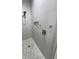 Tiled walk-in shower featuring a shower head, and recessed shelving at 15426 Mccomb Cir, Port Charlotte, FL 33981