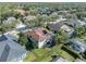 Beautiful aerial view of a home with a screened pool and a well-maintained lawn in a serene neighborhood at 15720 Ibisridge Dr, Lithia, FL 33547