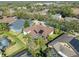 This is an aerial view of a home with a screened in pool area at 15720 Ibisridge Dr, Lithia, FL 33547