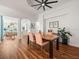 Dining area with wood floors, a stylish table, and an open layout at 15720 Ibisridge Dr, Lithia, FL 33547