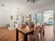 Open-concept dining area offers a stylish table and an open layout at 15720 Ibisridge Dr, Lithia, FL 33547