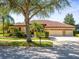 Beautifully landscaped yard complements this charming one story house at 15720 Ibisridge Dr, Lithia, FL 33547