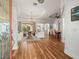 Spacious living room with hardwood floors, comfortable seating, and view to the patio at 15720 Ibisridge Dr, Lithia, FL 33547