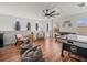Spacious entertainment room with a hockey table, multiple seating options, and ample natural light at 15720 Ibisridge Dr, Lithia, FL 33547