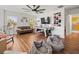 Open-concept living room featuring a hockey table, a comfortable seating arrangement, and a wall of caps as decoration at 15720 Ibisridge Dr, Lithia, FL 33547