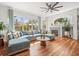 Cozy living room features tile fireplace, large windows, and stylish decor at 15720 Ibisridge Dr, Lithia, FL 33547