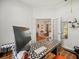 Bright office featuring a unique desk, french doors, and view into the living room at 15720 Ibisridge Dr, Lithia, FL 33547