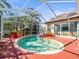 Outdoor pool with a screened enclosure and ample deck space at 15720 Ibisridge Dr, Lithia, FL 33547