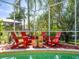 Relaxing poolside view with comfortable seating and lush greenery providing shade and privacy at 15720 Ibisridge Dr, Lithia, FL 33547
