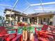 Expansive screened-in pool area with seating, perfect for outdoor entertaining and relaxation at 15720 Ibisridge Dr, Lithia, FL 33547