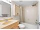 Bathroom featuring beige vanity and a shower/tub combo at 2003 Mcmullen Ave, Dunedin, FL 34698