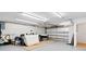 Spacious garage with fluorescent lighting, offering ample storage and parking at 2003 Mcmullen Ave, Dunedin, FL 34698
