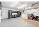 Organized garage space equipped with storage cabinets and ample room for parking at 2003 Mcmullen Ave, Dunedin, FL 34698