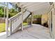 Covered patio with access to backyard, offering space for outdoor relaxation at 2003 Mcmullen Ave, Dunedin, FL 34698