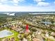 Expansive aerial view of a residential neighborhood with numerous homes, lakes, and green spaces in a sprawling community at 2604 Dakota Rock Dr, Ruskin, FL 33570