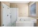 Bright bathroom featuring a soaking tub and glass enclosed shower at 2604 Dakota Rock Dr, Ruskin, FL 33570