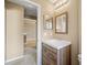 Bathroom featuring a single sink with cabinet and entry to the kitchen at 2604 Dakota Rock Dr, Ruskin, FL 33570