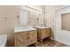 Bathroom featuring double sinks with designer cabinets and tile flooring at 2604 Dakota Rock Dr, Ruskin, FL 33570