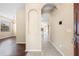 Inviting home foyer featuring tile flooring, archways, and a glimpse into the adjacent living areas at 2604 Dakota Rock Dr, Ruskin, FL 33570