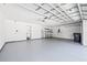 Spacious garage with room for two cars, storage, and a utility sink at 2604 Dakota Rock Dr, Ruskin, FL 33570