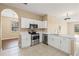 Bright kitchen featuring white cabinetry, stainless steel appliances, and an open layout at 2604 Dakota Rock Dr, Ruskin, FL 33570