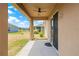 Covered patio overlooks the yard and offers great light and views at 2604 Dakota Rock Dr, Ruskin, FL 33570