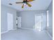 This room has an open entryway, lots of light, with ceiling fan, and two door openings at 31132 Masena Dr, Wesley Chapel, FL 33545