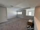 Bonus room featuring carpeted floors, natural light, and a spacious layout at 33947 Astoria Cir, Wesley Chapel, FL 33545