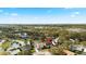Aerial view of a home, showcasing its location within a vibrant community near a serene lake at 3414 Shady Brook Ln, Sarasota, FL 34243