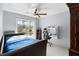 This light blue bedroom features a pool view from the sliding glass door at 3414 Shady Brook Ln, Sarasota, FL 34243