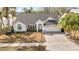 Well-maintained single-Gathering home with an attached garage and manicured lawn at 3414 Shady Brook Ln, Sarasota, FL 34243