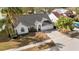 Charming single-Gathering home with a well-kept lawn, driveway, and lush landscaping at 3414 Shady Brook Ln, Sarasota, FL 34243