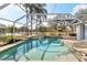 An inviting pool with a screen enclosure at 3414 Shady Brook Ln, Sarasota, FL 34243