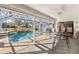 A covered pool and patio for entertaining at 3414 Shady Brook Ln, Sarasota, FL 34243