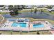 Aerial view of community pool and lake at 36645 Kay Ave, Zephyrhills, FL 33542