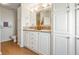 Well-lit bathroom with double vanity, white cabinets, and plenty of storage space at 36645 Kay Ave, Zephyrhills, FL 33542