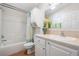 Bathroom features a tub and shower, vanity, and ample cabinet space at 36645 Kay Ave, Zephyrhills, FL 33542