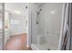 Bright bathroom featuring a walk-in shower with a seat, ensuring ease and accessibility at 36645 Kay Ave, Zephyrhills, FL 33542