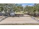 Community bocce ball court under large shade trees, featuring benches and a gazebo in the background at 36645 Kay Ave, Zephyrhills, FL 33542
