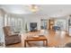 Bright living room with hardwood floors, a ceiling fan, and a large window at 36645 Kay Ave, Zephyrhills, FL 33542