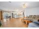 Bright living room with hardwood floors, a ceiling fan, and open concept layout at 36645 Kay Ave, Zephyrhills, FL 33542