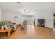 Spacious living room with natural light, wood laminate flooring, and comfortable seating at 36645 Kay Ave, Zephyrhills, FL 33542