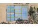 Aerial view of multiple outdoor community pickleball courts with nets and colorful playing surfaces at 36645 Kay Ave, Zephyrhills, FL 33542